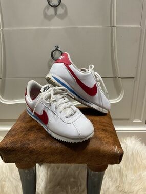 Kids Nike White Sneakers with Red Swoosh and Blue Stripe
